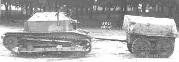 Profile view of a TK-3, towing a tracked trailer